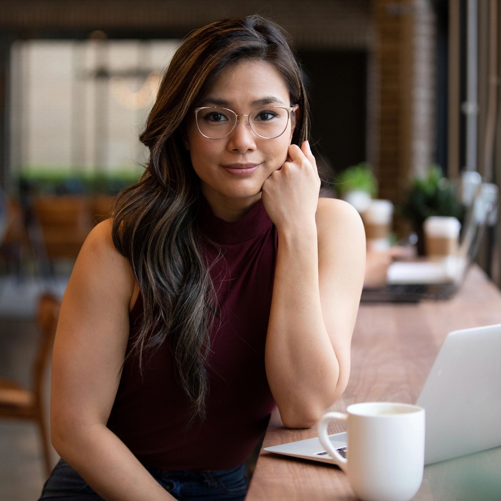 Portrait of a smiling business owner in natural light
