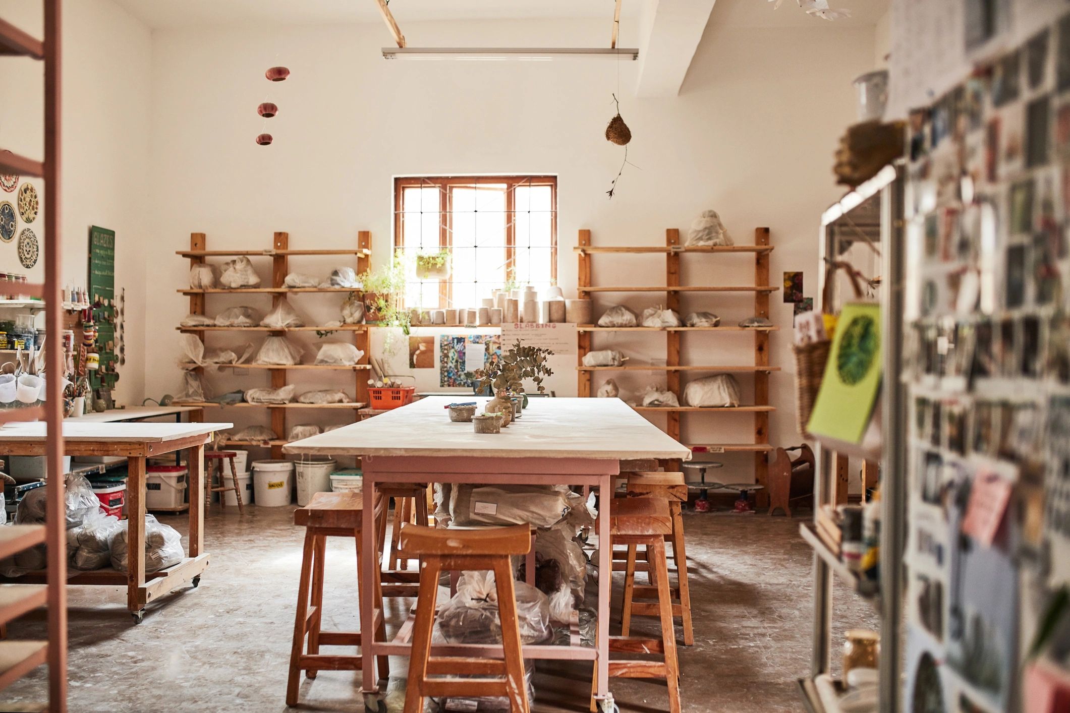 Sunlit creative workspace with handmade craft pieces