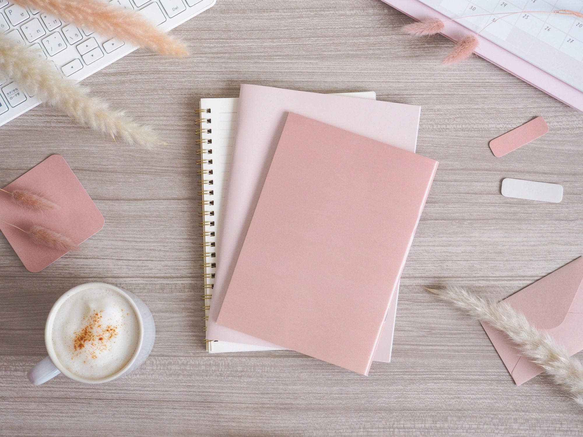 Stationery and desk flat lay with soft neutral tones